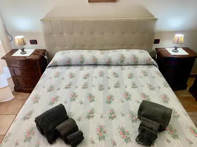Letto o letti in una camera di casa vacanza V&G