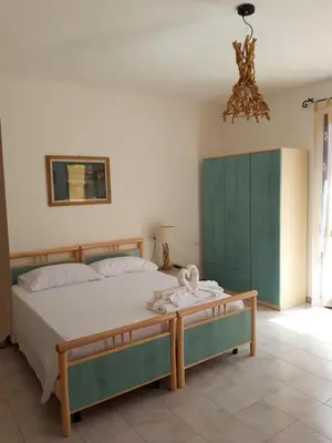 Letto o letti in una camera di S'Apposentu ( La Camera)