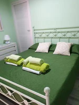 Letto o letti in una camera di Casa vacanze El Flamingo Rosa