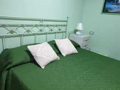 Letto o letti in una camera di Casa vacanze El Flamingo Rosa