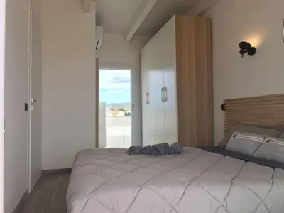 Letto o letti in una camera di Attico vista mare