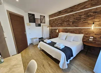 Letto o letti in una camera di ARYA Cagliari