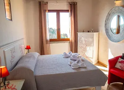 Letto o letti in una camera di Il Tramonto Tanca Piras