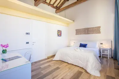 Letto o letti in una camera di Residenza le Scalette