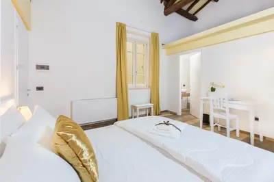 Letto o letti in una camera di Residenza le Scalette