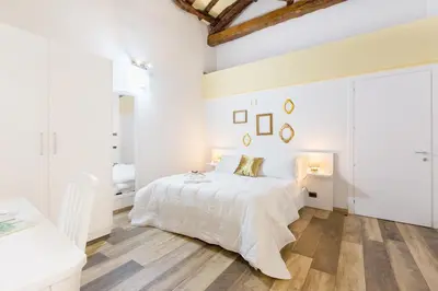 Letto o letti in una camera di Residenza le Scalette