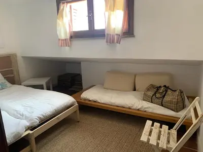Letto o letti in una camera di Villasimius villetta a 300 mt dalla spiaggia Via Libeccio n 67