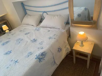 Letto o letti in una camera di Villasimius villetta a 300 mt dalla spiaggia Via Libeccio n 67