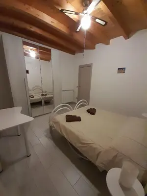Letto o letti in una camera di Casa Rosa dei Venti