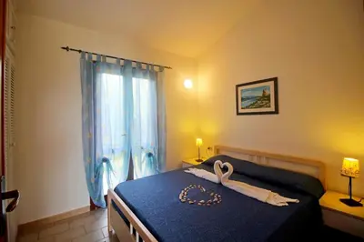 Letto o letti in una camera di Villetta Turagri 38