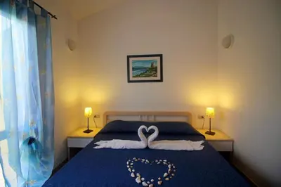 Letto o letti in una camera di Villetta Turagri 38
