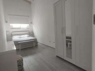 Letto o letti in una camera di IKEBANA VILLAS PORTO PINO BEACH