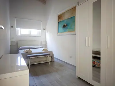 Letto o letti in una camera di IKEBANA VILLAS PORTO PINO BEACH