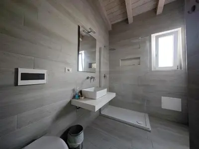 Bagno di IKEBANA VILLAS PORTO PINO BEACH