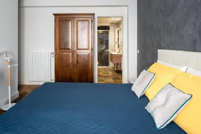 Letto o letti in una camera di Marcus Suite