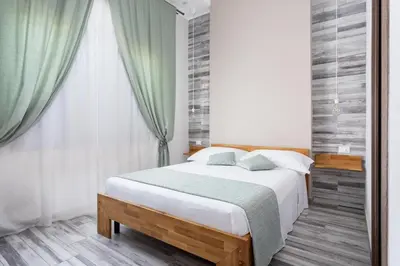 Letto o letti in una camera di Vittoria Rooms