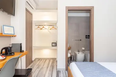 Letto o letti in una camera di Vittoria Rooms