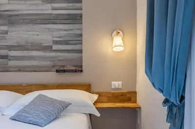 Letto o letti in una camera di Vittoria Rooms