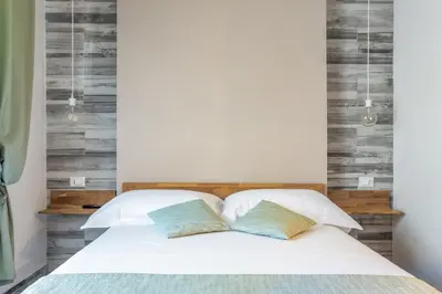 Letto o letti in una camera di Vittoria Rooms