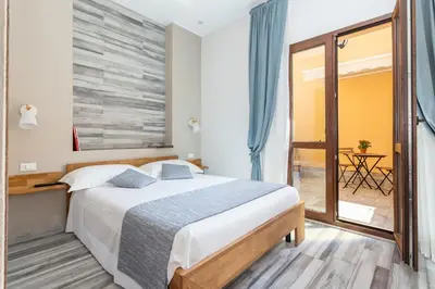 Letto o letti in una camera di Vittoria Rooms