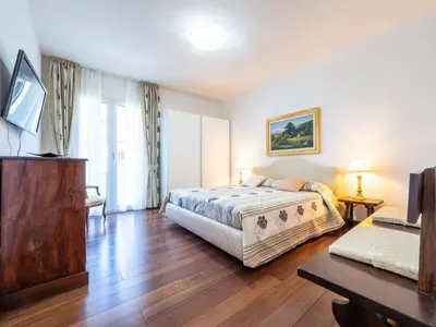 Letto o letti in una camera di B&B Le Bouganville