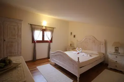 Letto o letti in una camera di TRILOCALE MARGHERITA
