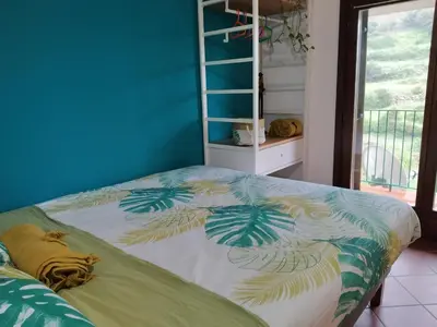 Letto o letti in una camera di B&B Taccu Maccu