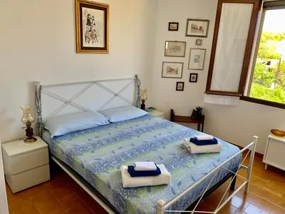 Letto o letti in una camera di Sa Corbula