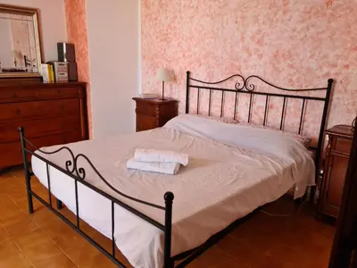 Letto o letti in una camera di Sa Corbula