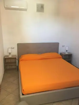 Letto o letti in una camera di Casa Teresa a Porto Pino
