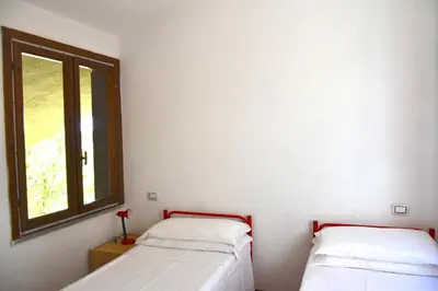 Letto o letti in una camera di Domus Carlotta Apartment with sea view Villasimius
