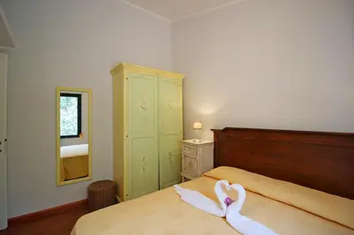Letto o letti in una camera di Villa Azzurra nel centro di Costa Rei