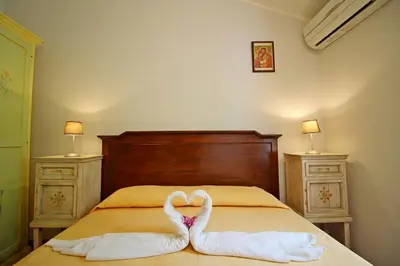 Letto o letti in una camera di Villa Azzurra nel centro di Costa Rei