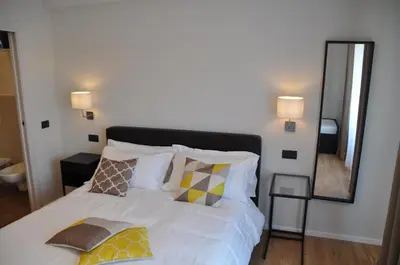 Letto o letti in una camera di EVA LUXURY ROOMS CAGLIARI