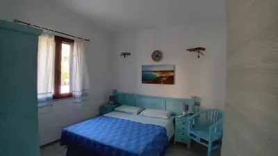 Letto o letti in una camera di Villa Margherita vista mare
