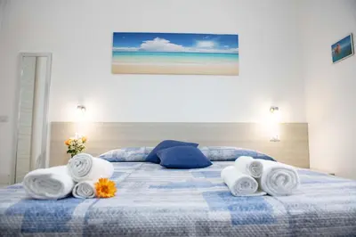 Letto o letti in una camera di B&B Il Viaggiatore