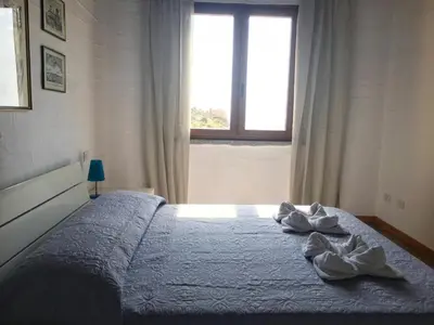 Letto o letti in una camera di L'Emozione Tanca Piras