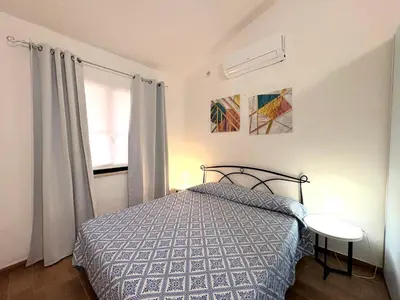 Letto o letti in una camera di Costa Rei Bilo Turagri vista mare