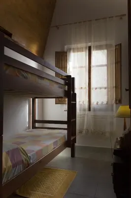 Letto o letti in una camera di Splendida Vista, Sardegna