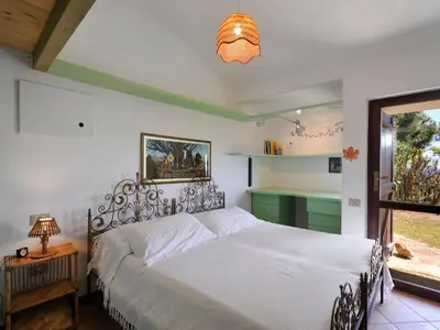 Letto o letti in una camera di Villa Ibisco