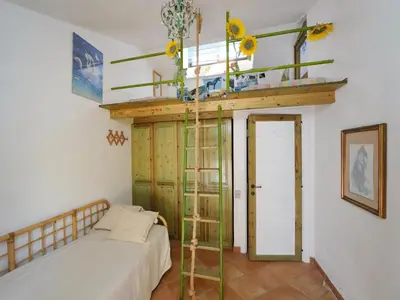 Letto o letti in una camera di Villa Ibisco