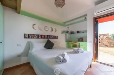 Letto o letti in una camera di Villa Ibisco