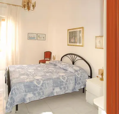 Letto o letti in una camera di Domus Mater