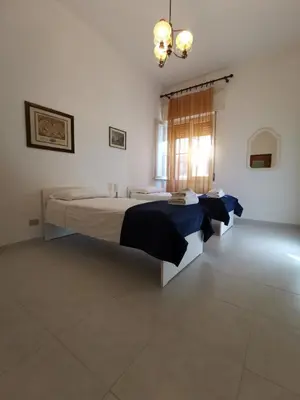 Letto o letti in una camera di Domus Mater