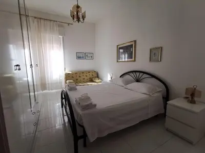 Letto o letti in una camera di Domus Mater