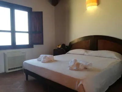 Letto o letti in una camera di Hotel Punta Moros