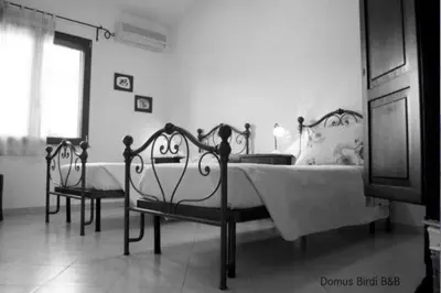 Letto o letti in una camera di Domus Birdi