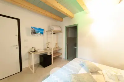 Letto o letti in una camera di PERDAS ROOMS