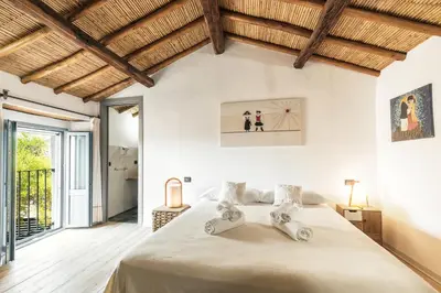 Letto o letti in una camera di Sa Crai B&B - Sardinian Experience