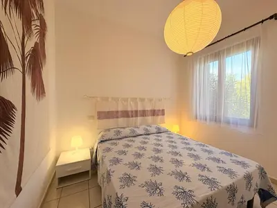 Letto o letti in una camera di Costa Rei Villa in Prima Fila Mare con Ampio Giardino